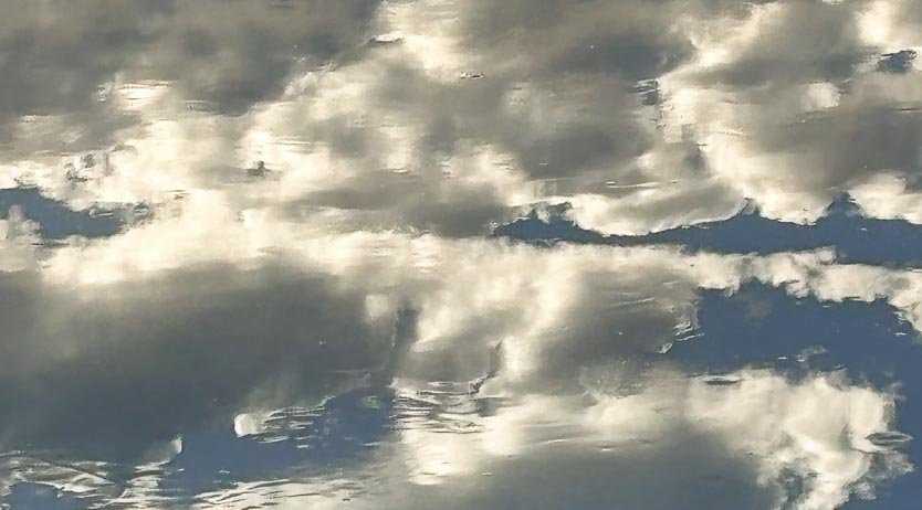 image of the sky reflected on water
